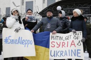Participants attend a rally in solidarity with the people of Aleppo and against Russia's support of the Syrian army and President Bashar al-Assad in Kiev
